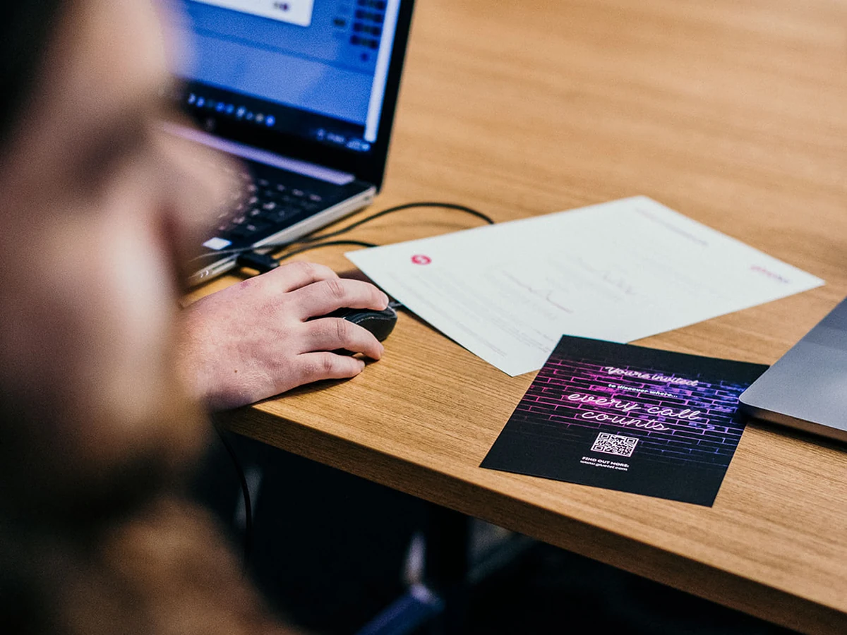 Campaign planning materials and GiveTel brochure on a meeting table