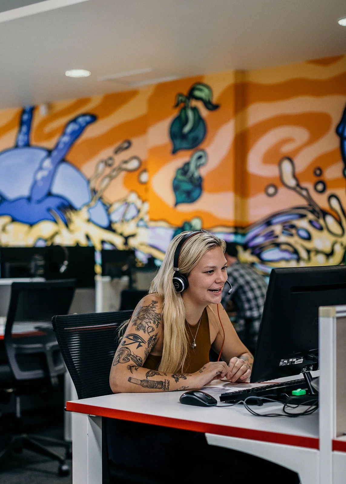 GiveTel team member speaking to a supporter with a headset